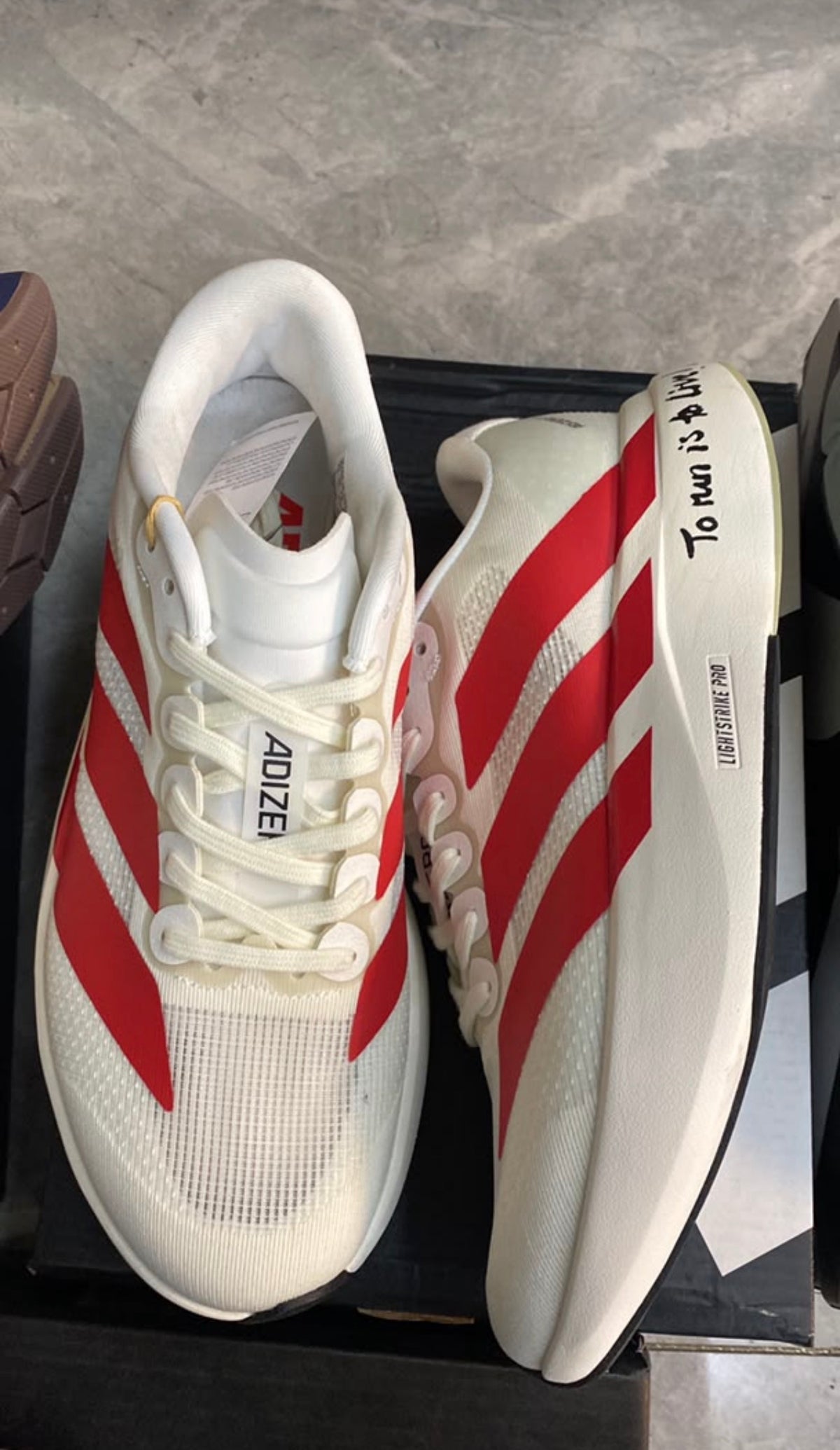 ADIZERO EVO SL BLANCO ROJO
